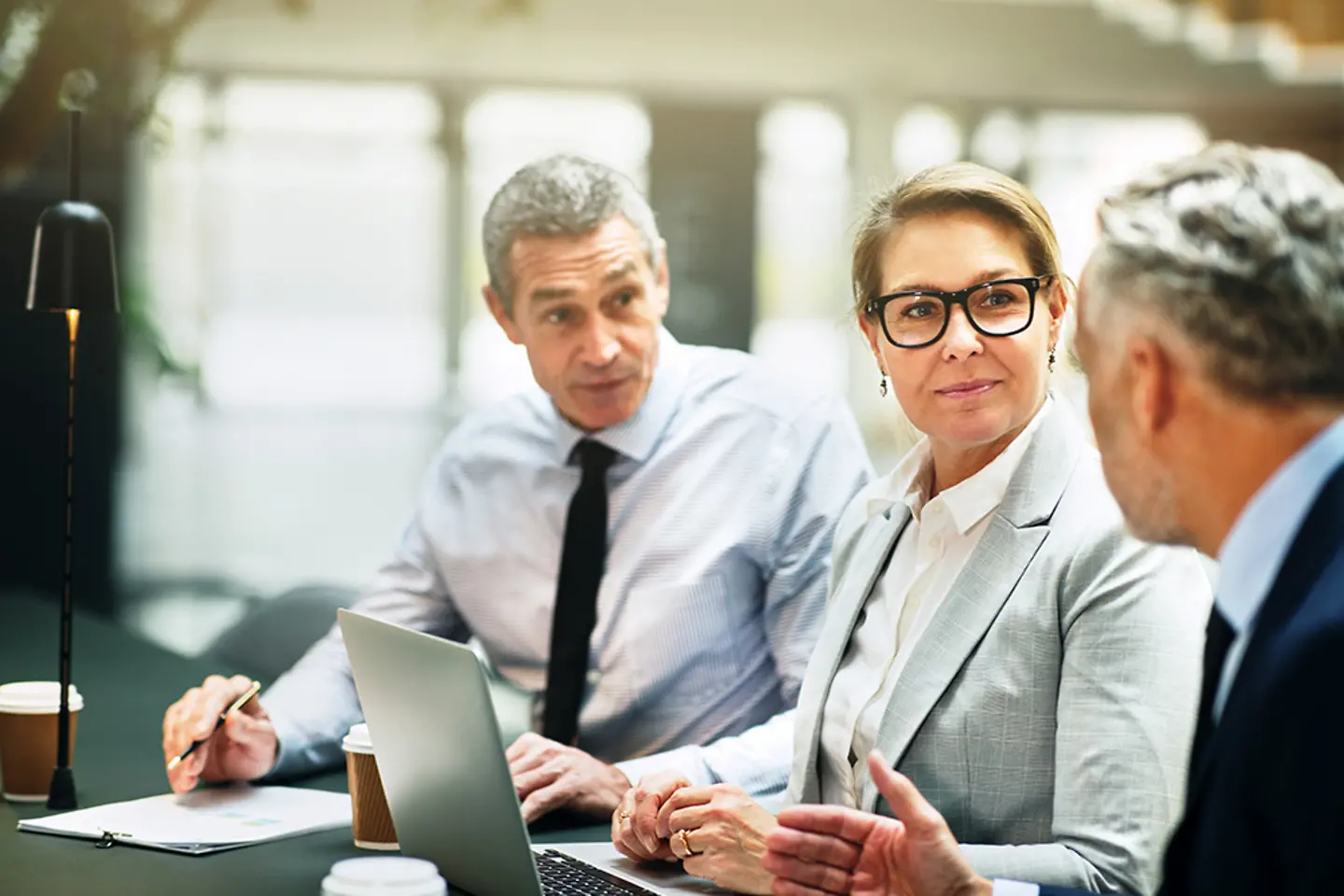 Three people in a business meeting