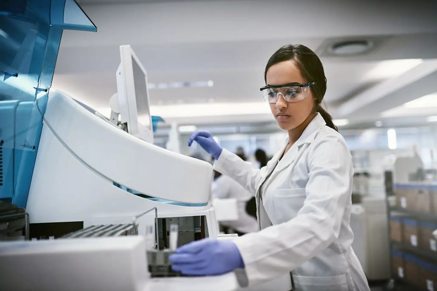 Female pathologist working on a computer