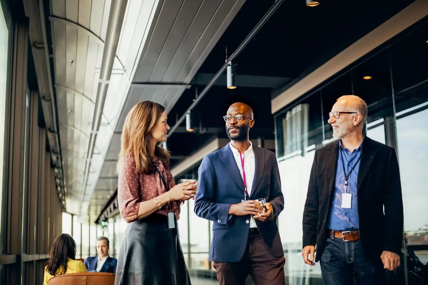 Business partners from different nations talking in an office building