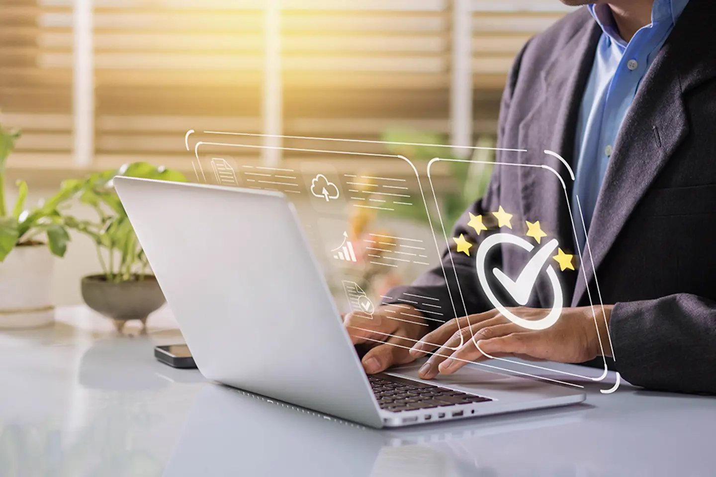 Businessman working on labtop with check mark and symbol of golden five stars