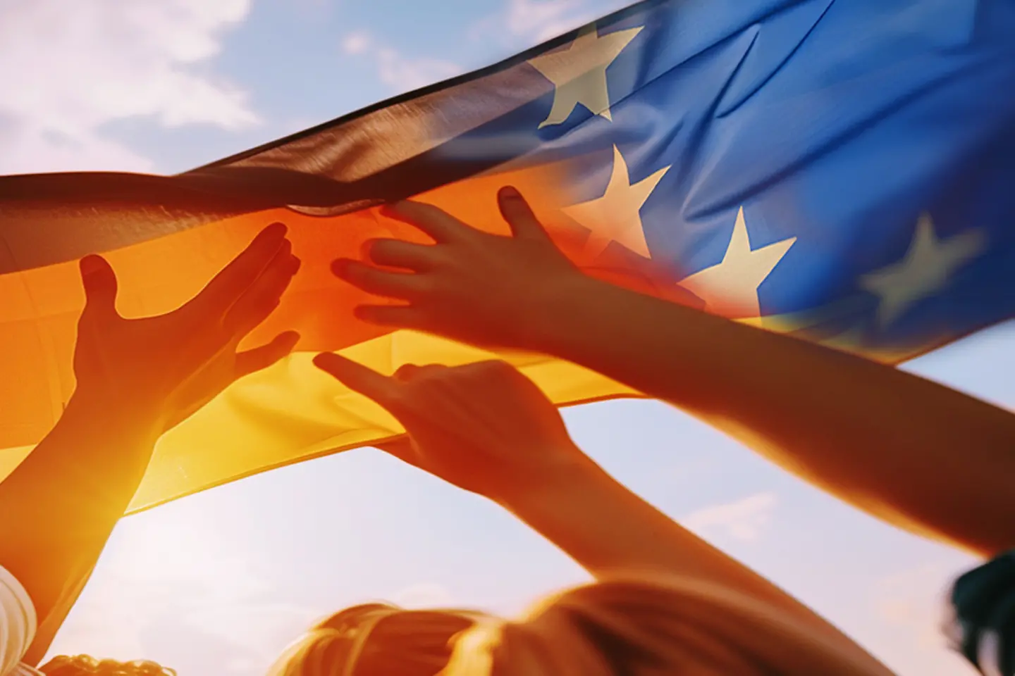 Group with German and European flags in hands symbolizes cohesion