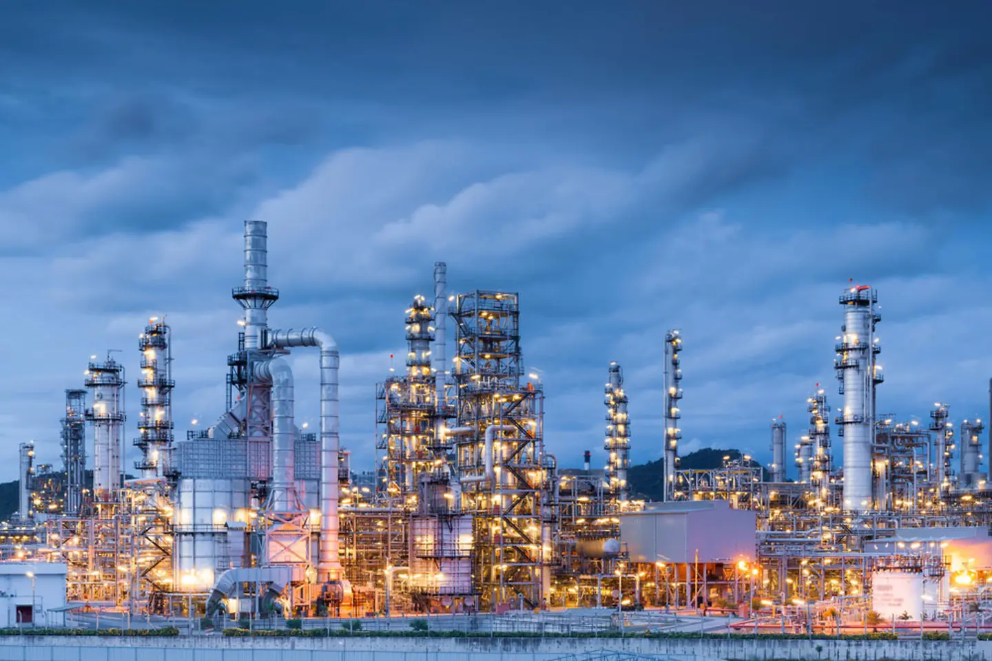 An oil refinery seen from a distance.