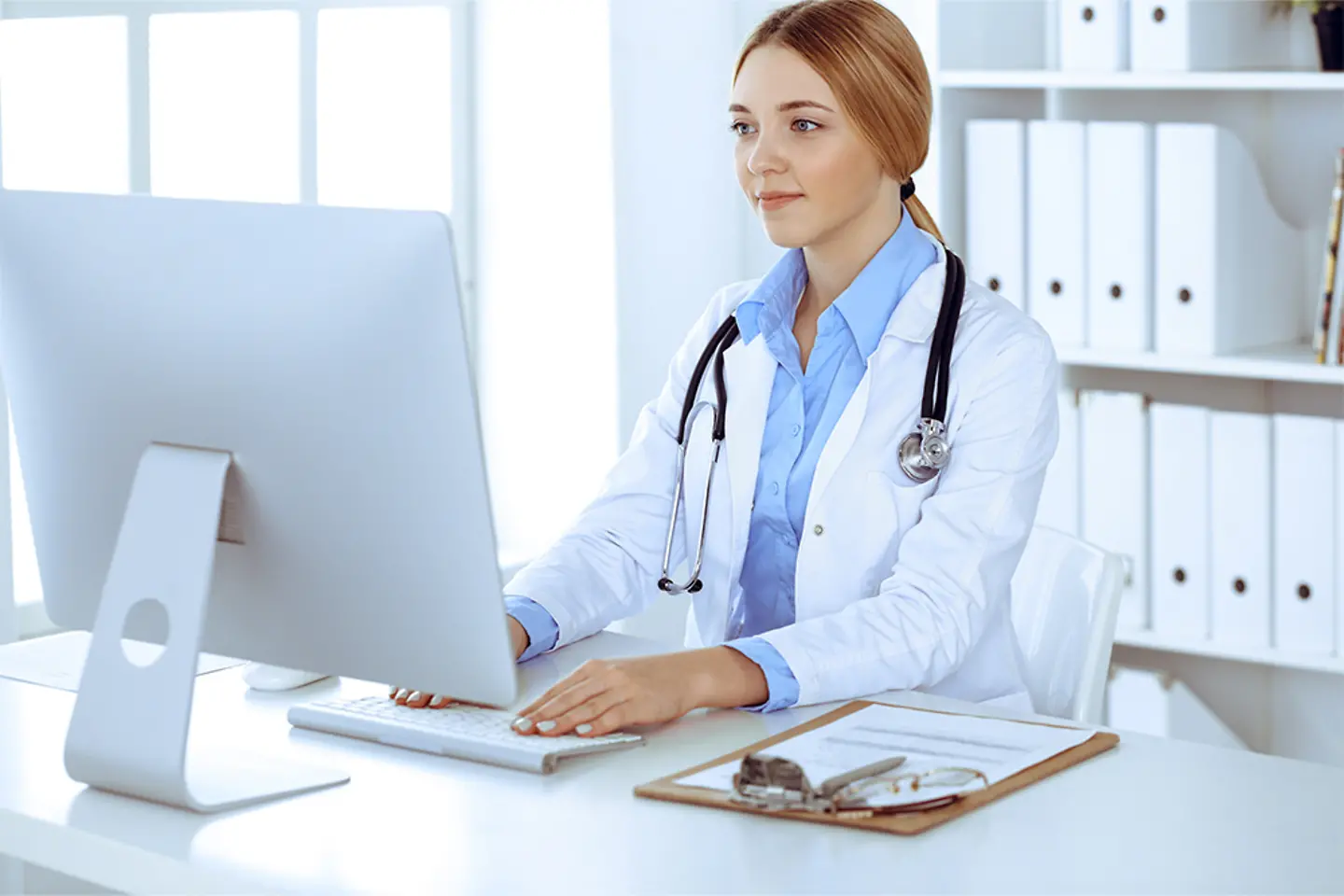 Female doctor typing 