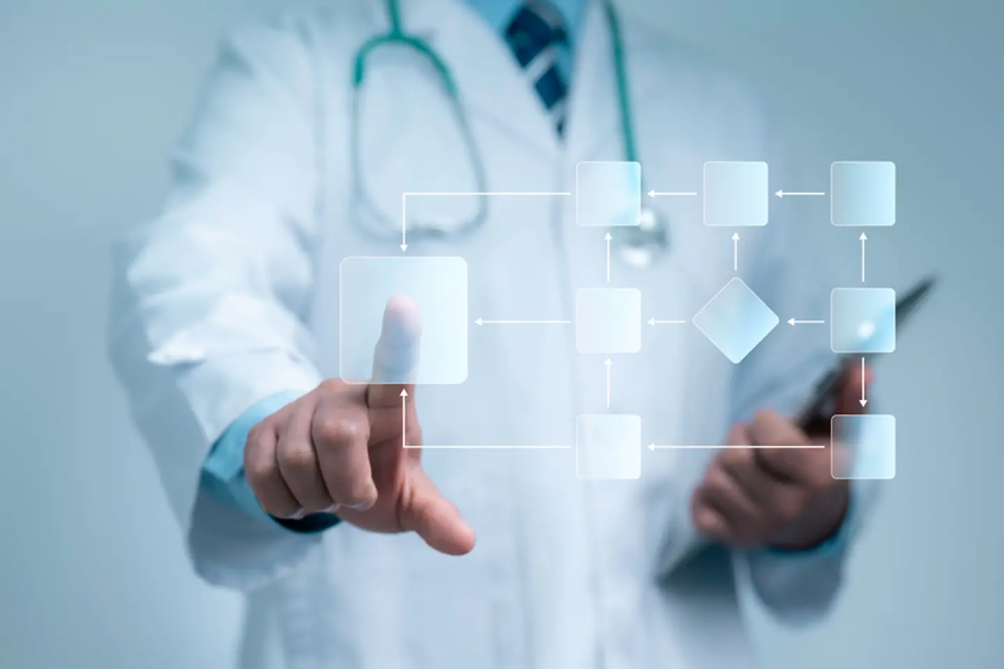 A doctor pointing at a virtual screen