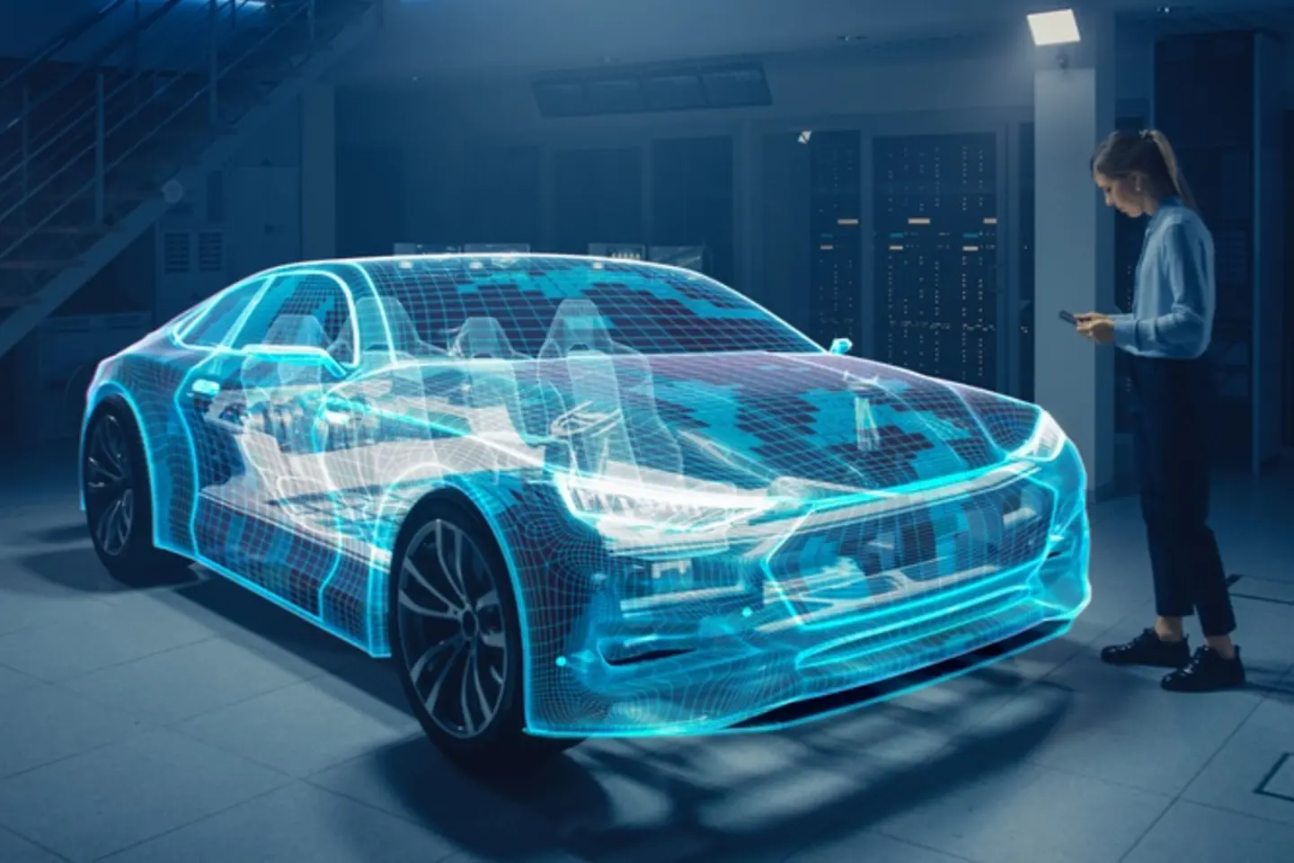 A woman with a smartphone stands in front of a digital image of a car in a server room.