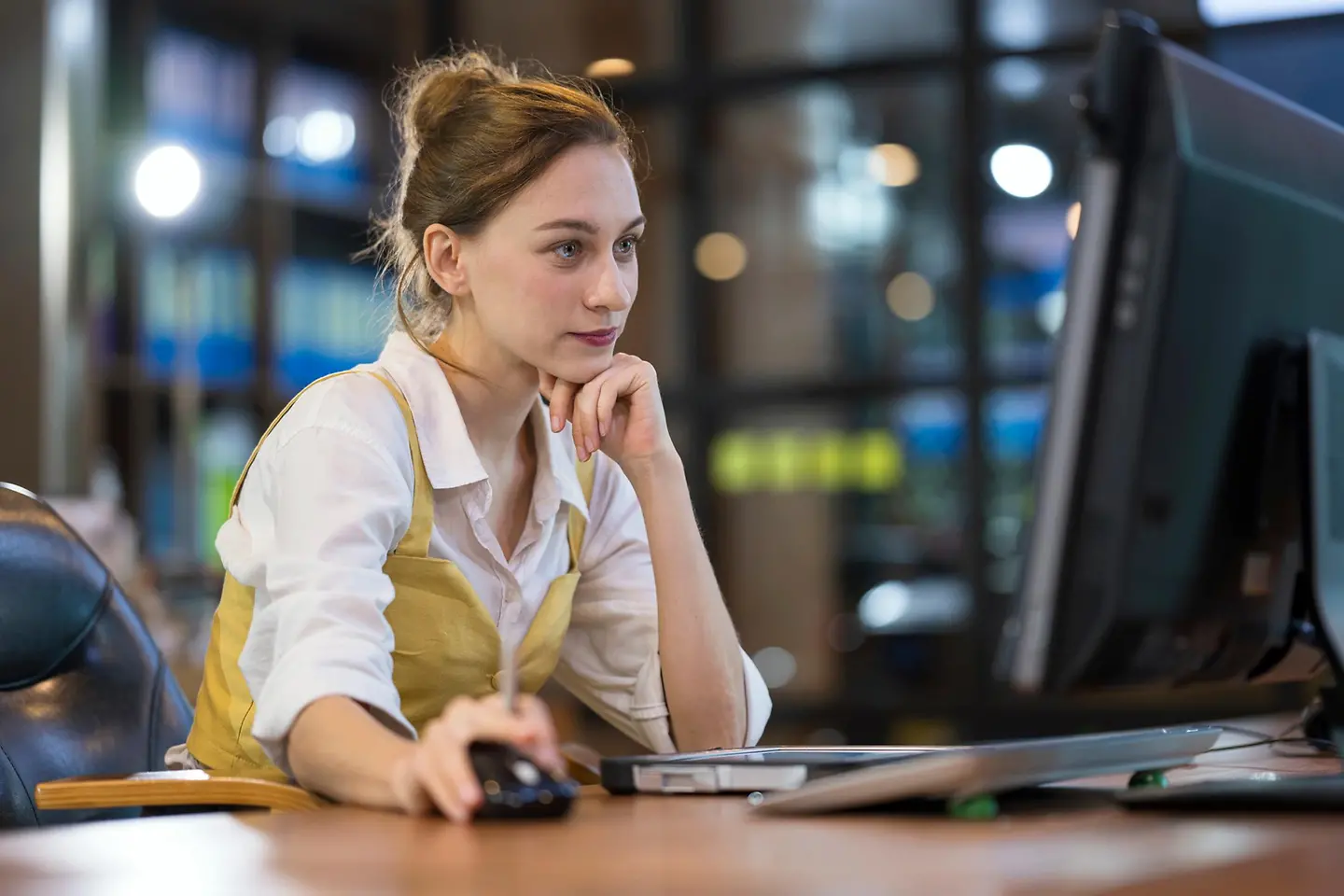 Portrait of a female office worker at her laptop