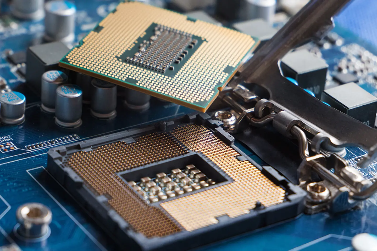 Bottom side of an modern CPU, showing its pins and CPU Socket on Motherboard