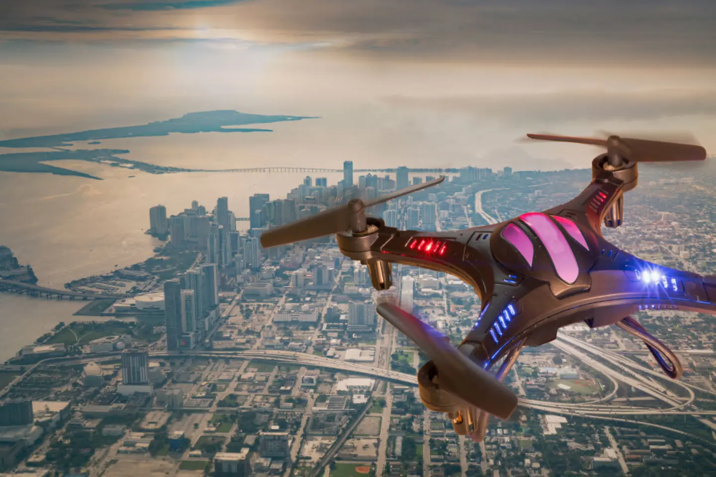 A drone hovers over a city