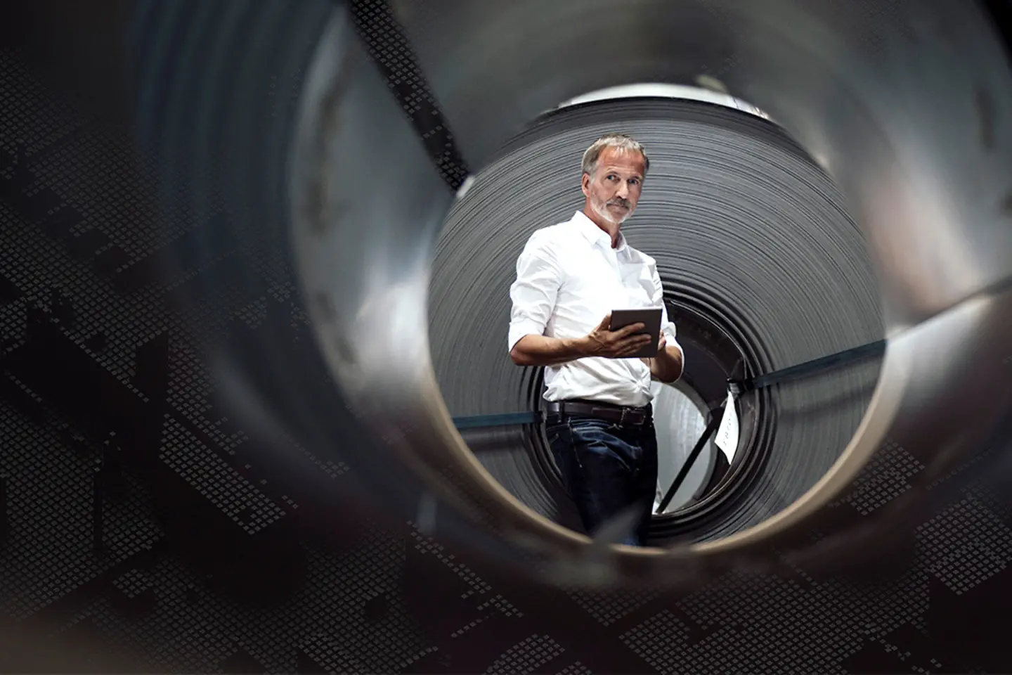 Professional using tablet in a factory