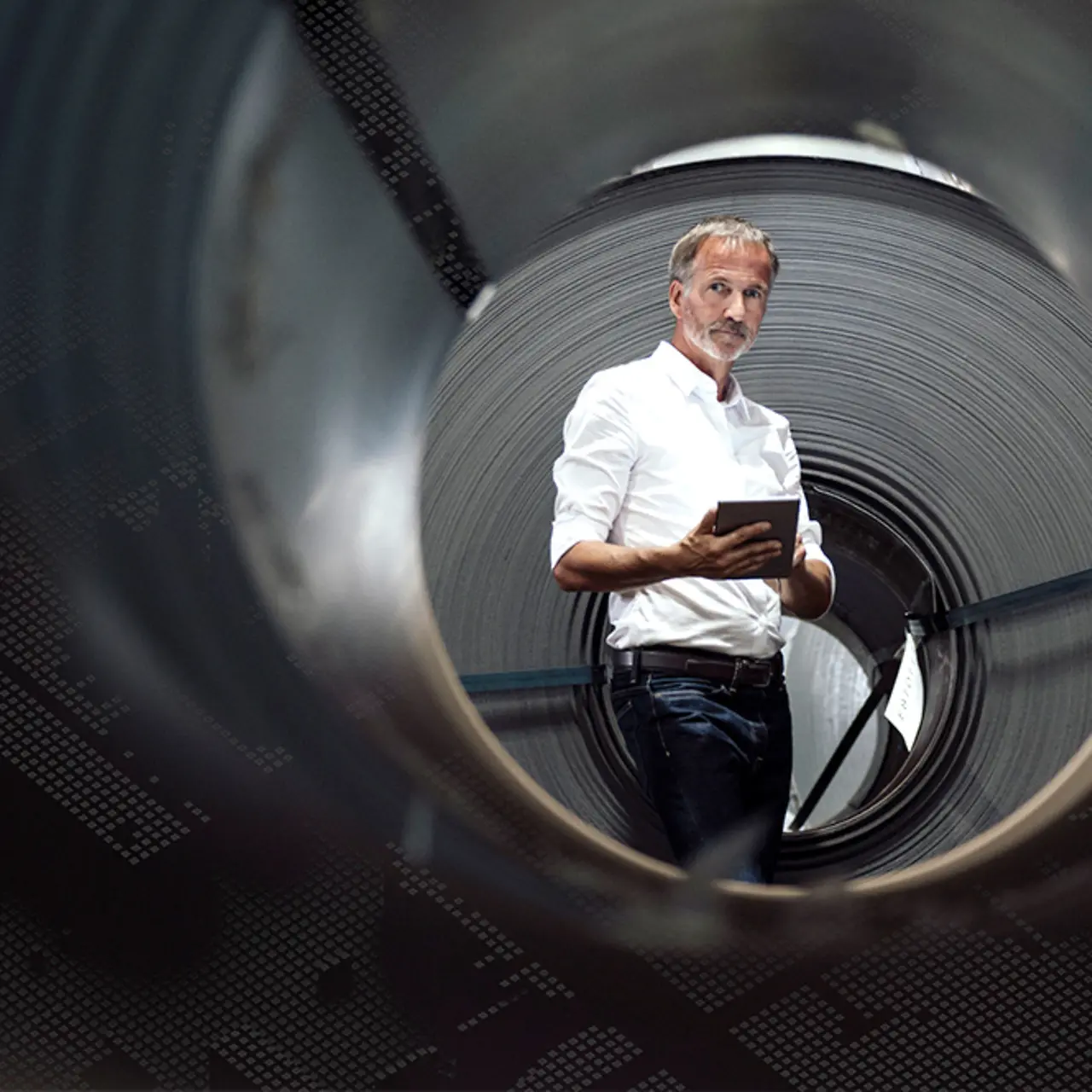 Professional using tablet in a factory